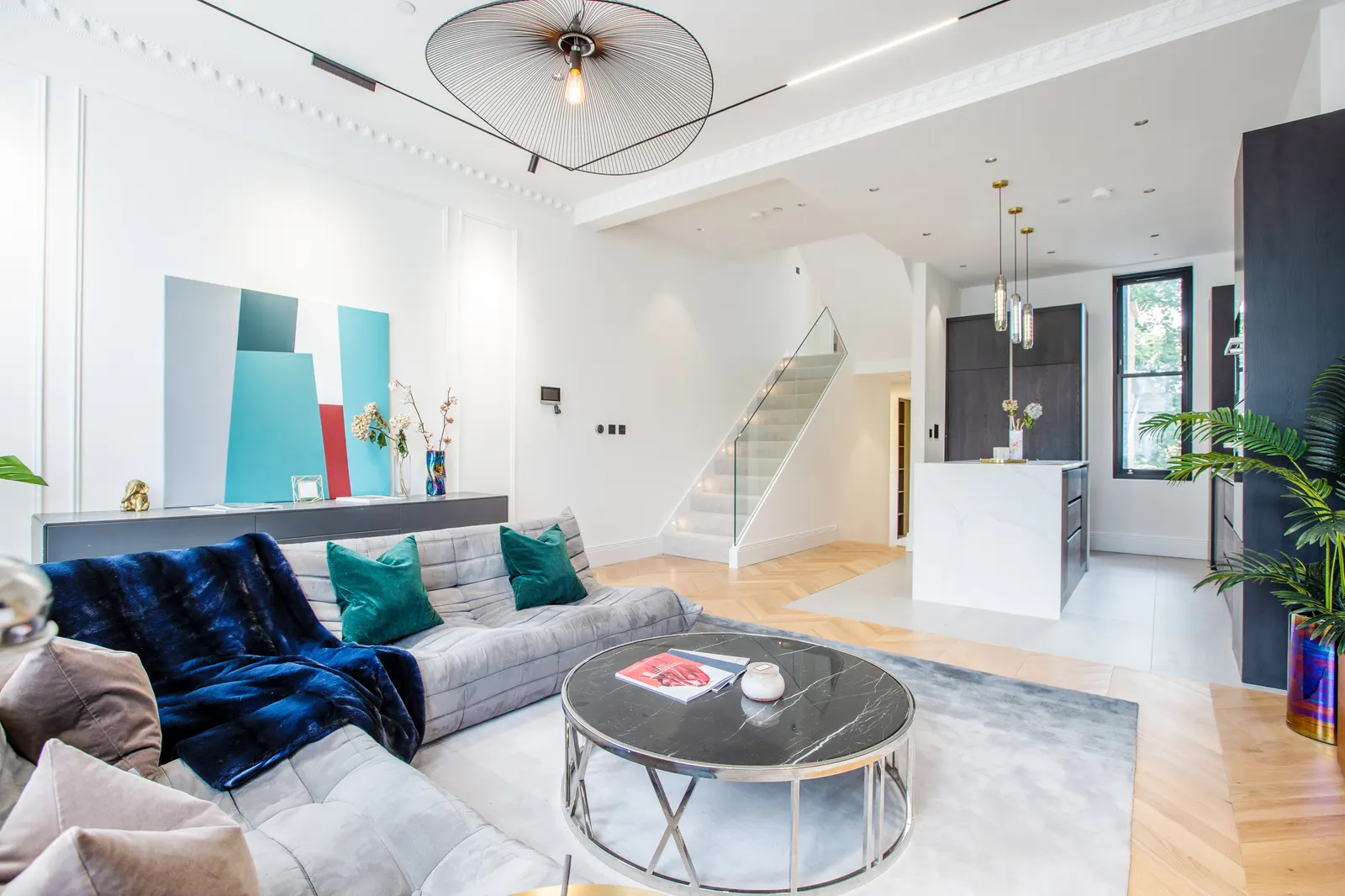 Living room with artwork and statement sofa
