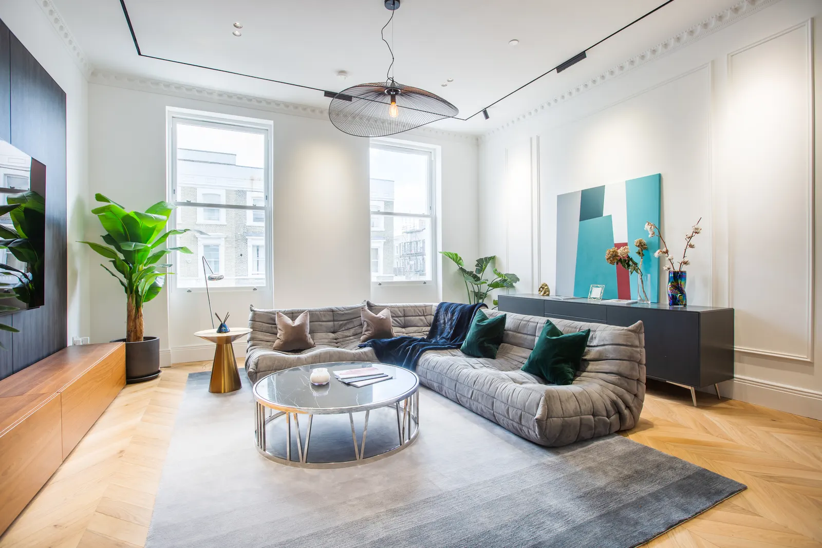 Living room seating by full-height windows