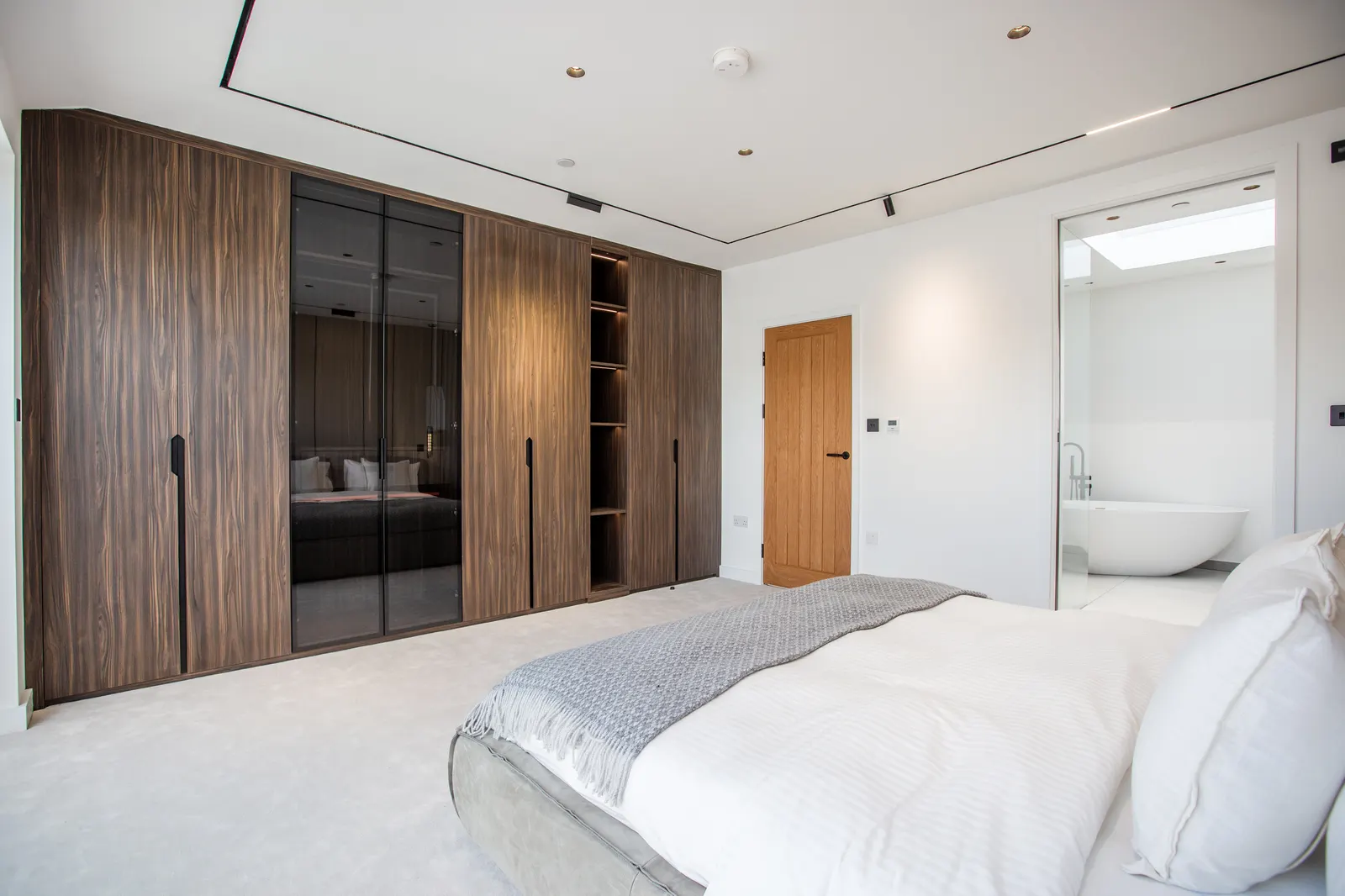 Fitted wardrobe with timber sliding doors