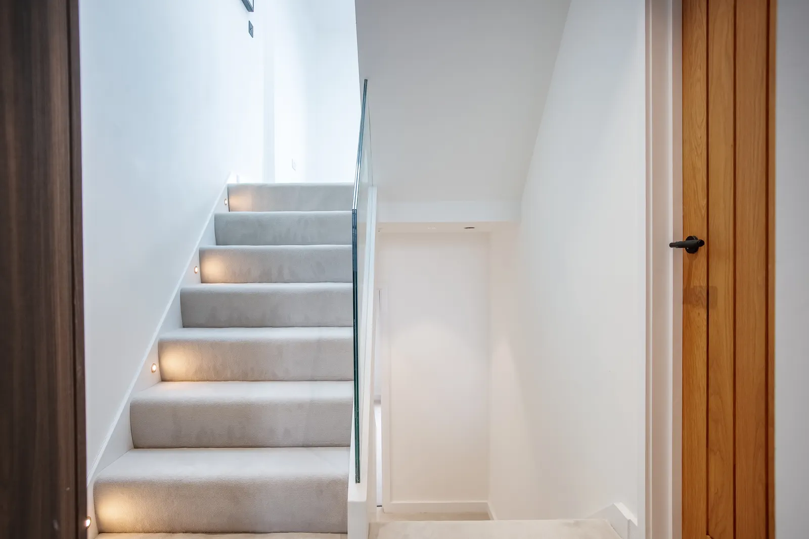 Stairwell with natural light and handrail