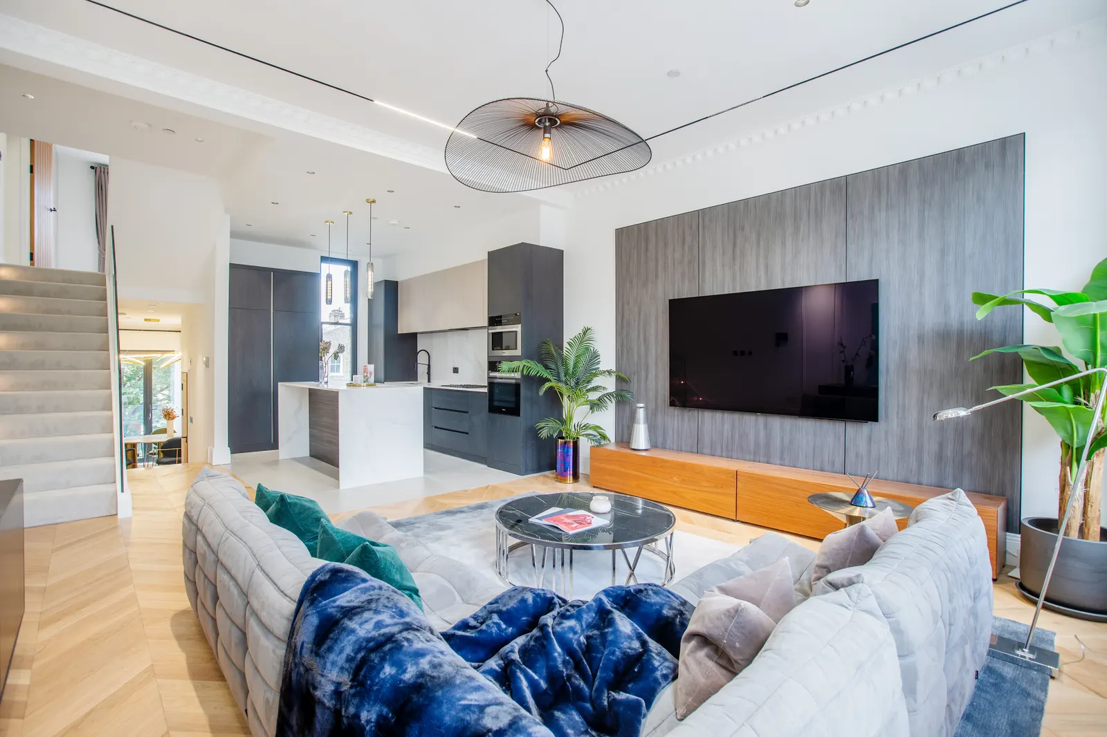 Living room with navy sofa and TV