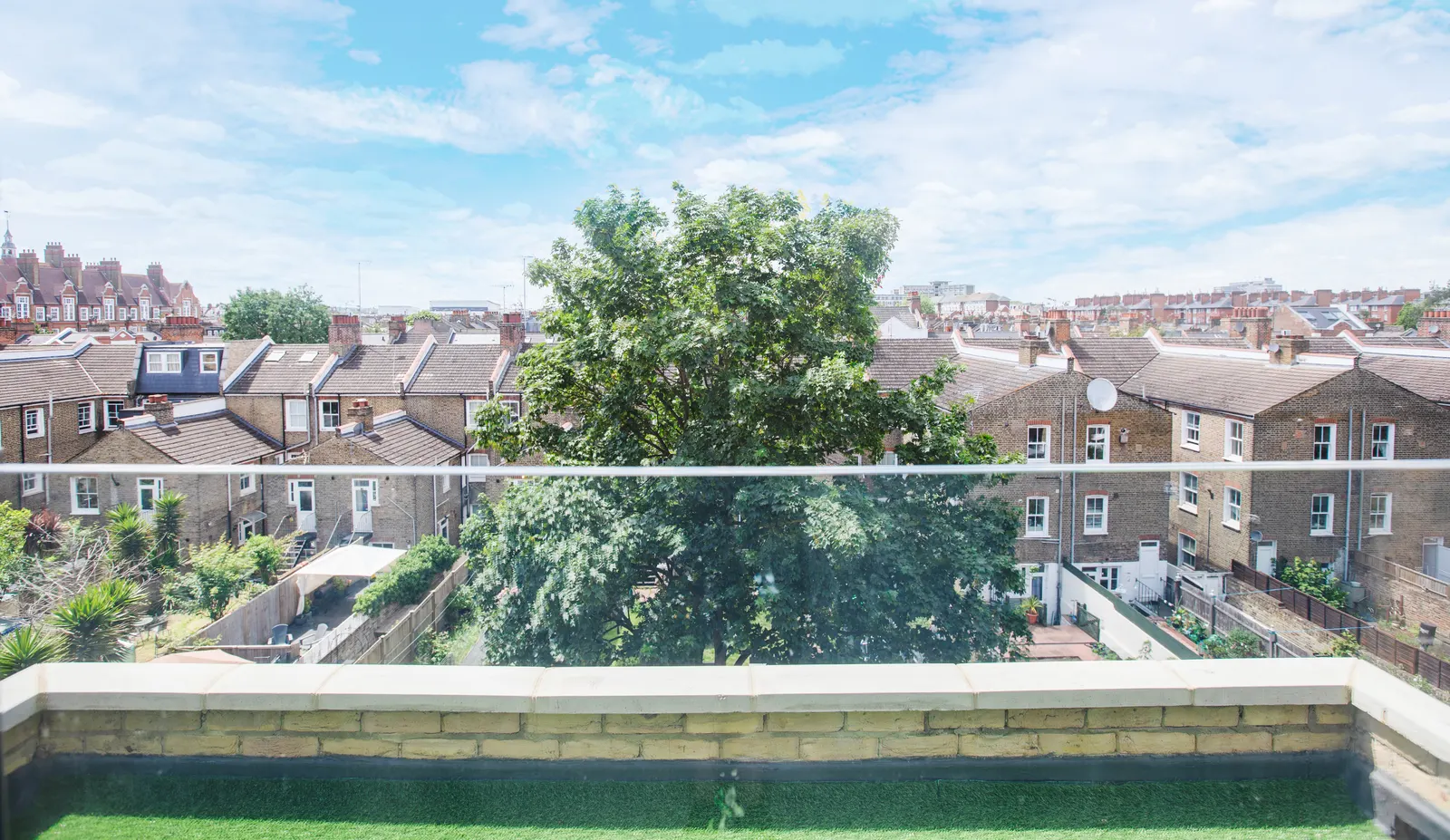 Roof terrace with planting and city view