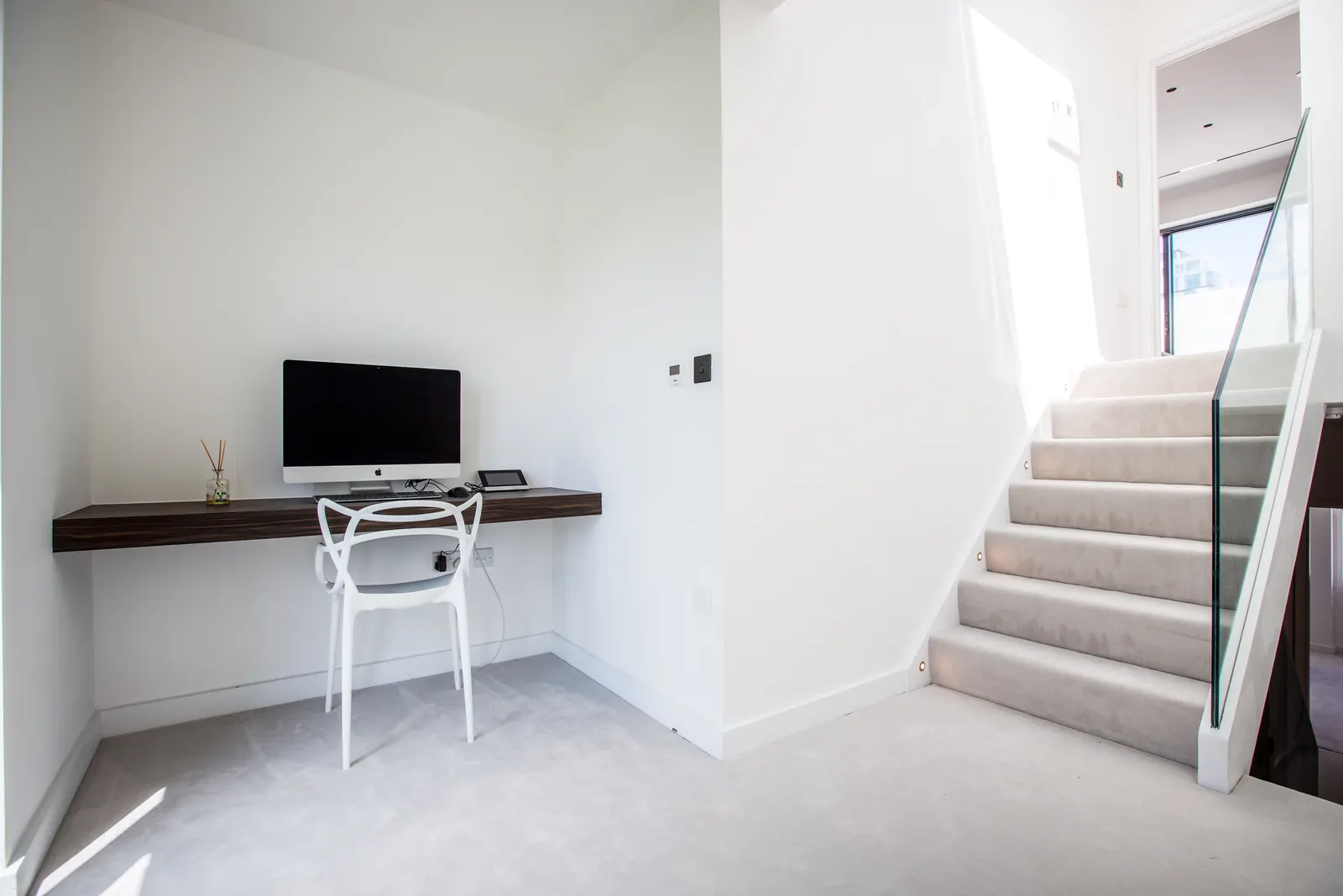 Home office nook with desk by stairs