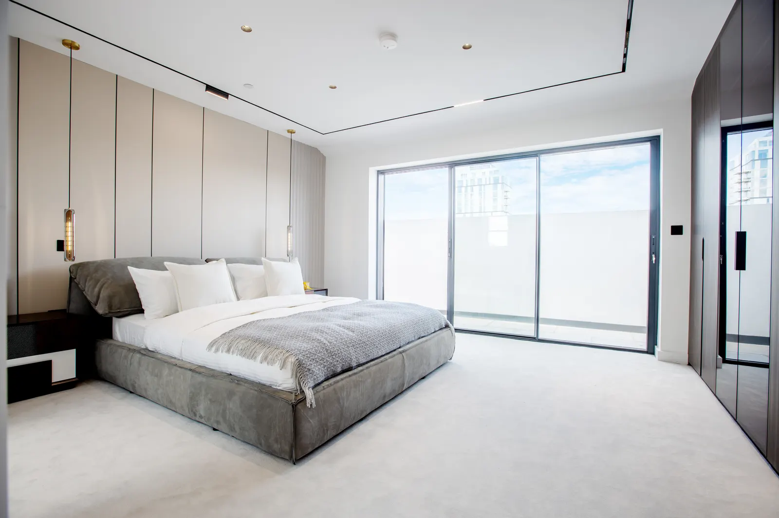 Bedroom with sliding doors to balcony