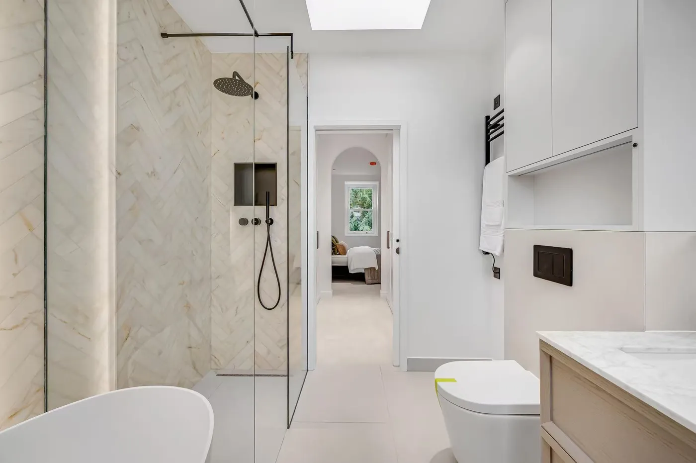 Bathroom with stone-effect surfaces and shower