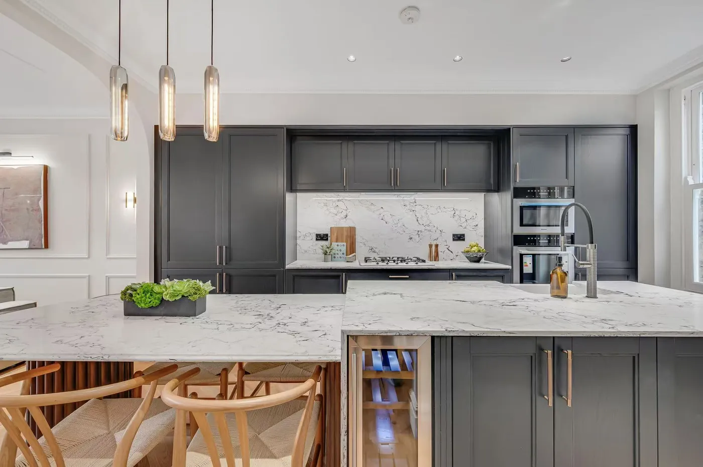 Kitchen with deep-tone cabinetry and island